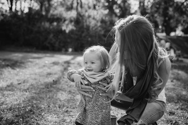istock young family walking in the park 665838268