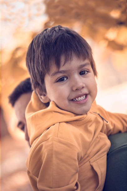 istock Father holding his son in park 665838918