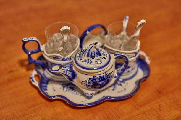 Porcelain set placed on orange wooden surfacePorcelain set placed on orange wooden surface