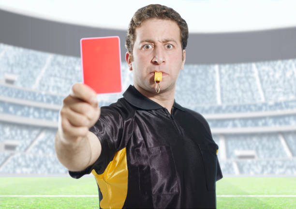 istock referee showing a red card in a stadium 665843102