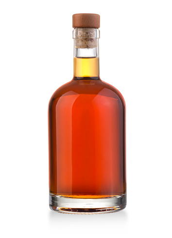 Cognac bottle isolated on black background.