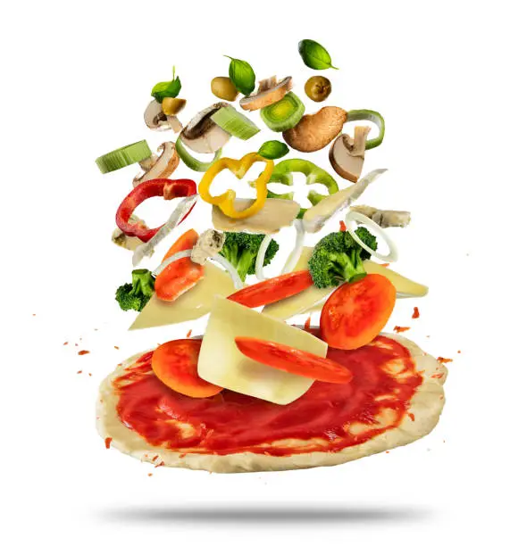 Photo of Flying ingredients with pizza dough, on white background