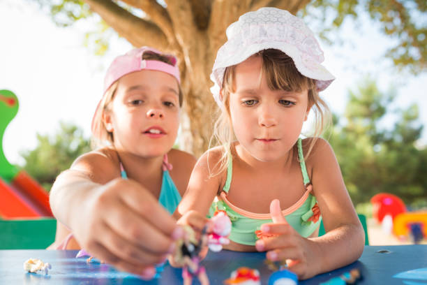 istock Children playing with small toys. 665856726