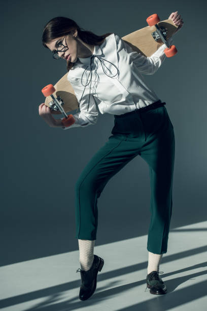 istock Young woman with skateboard 665879606