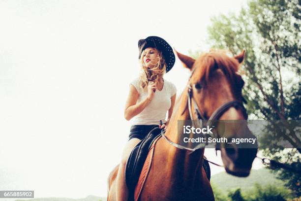 Cowgirl Riding A Horse Stock Photo - Download Image Now - Adult, Adults Only, Agriculture