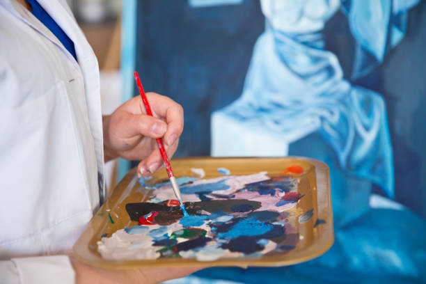 istock Fine art students painting 665889110
