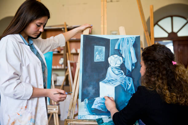 istock Fine art students painting 665889120