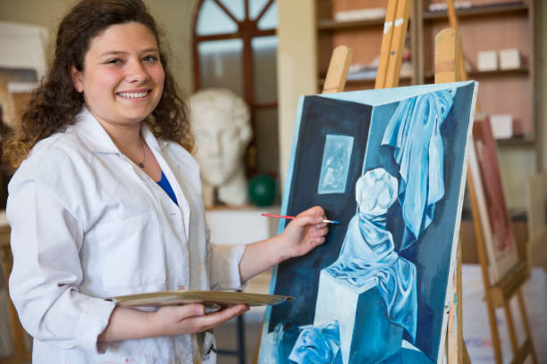 istock Fine art students painting 665889136