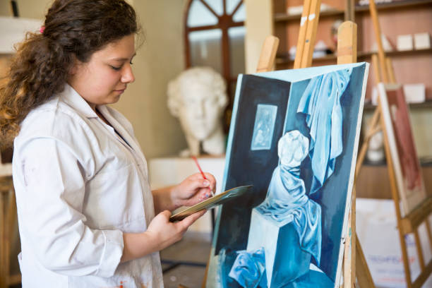 istock Fine art students painting 665889196