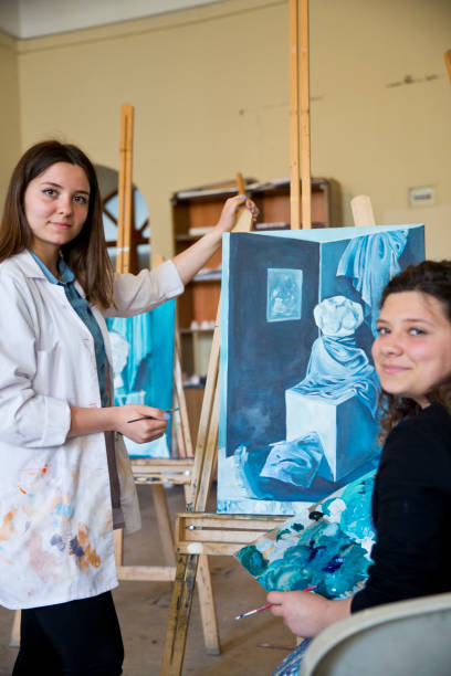 istock Fine art students painting 665889246