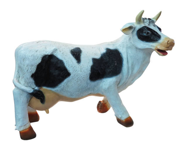 istock White and black cow toy figurine isolated 665889636