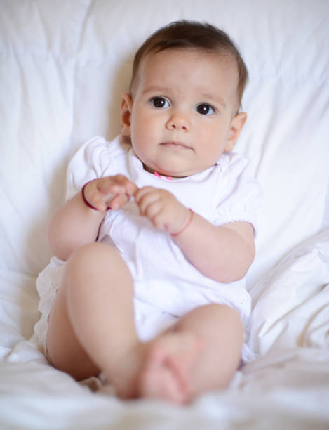istock Beautiful baby girl looking at camera 665895250