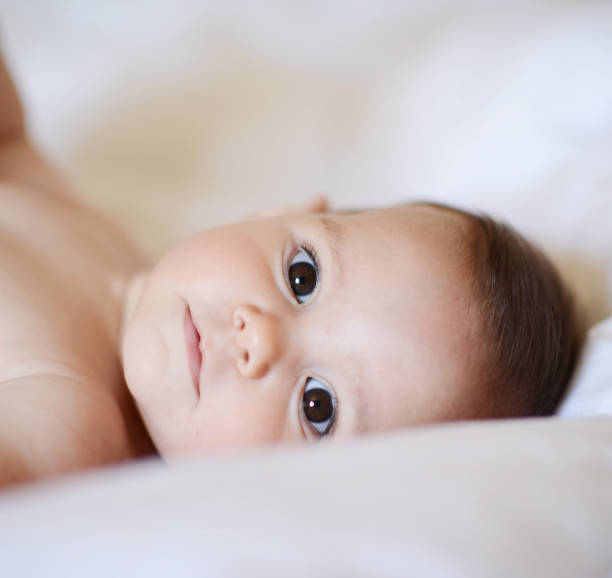 istock Beautiful baby girl looking at camera 665895374