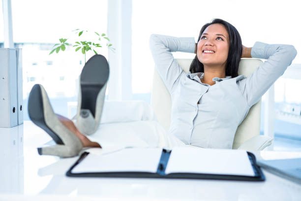 istock Smiling businesswoman relaxing 665907402