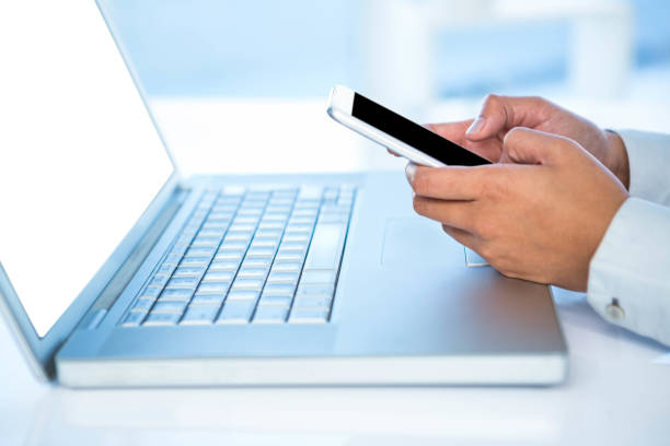 istock Cropped image of woman using smartphone 665907760