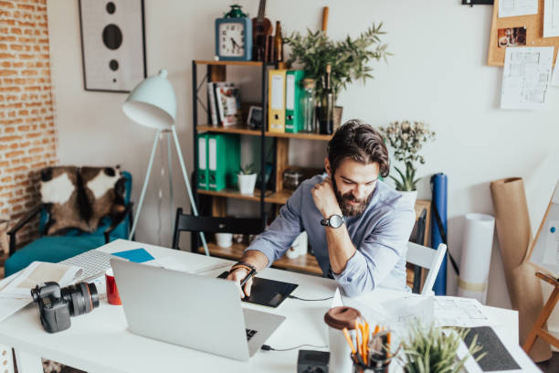istock Young photographer working in his home office 665910668