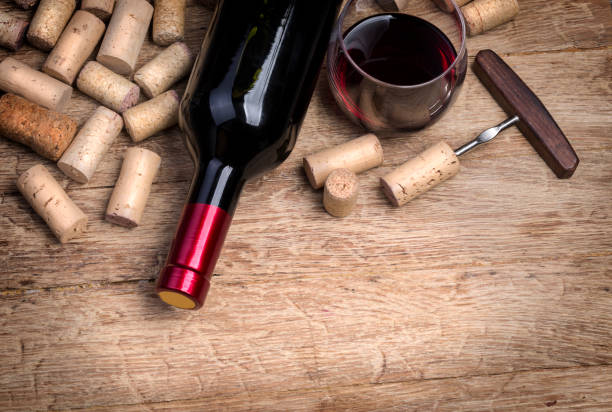 istock Glass bottle of wine with corks 665914184