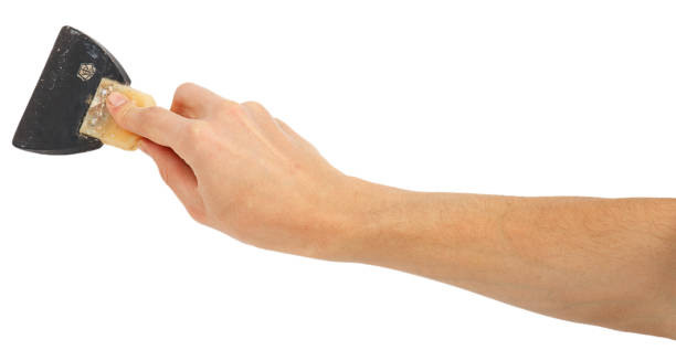 istock Old trowel in male hand 665922130