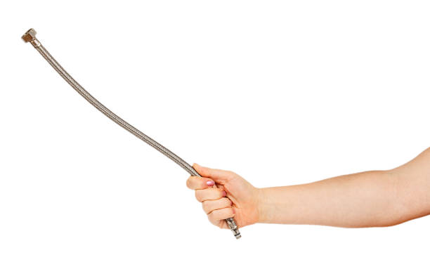istock Flexible hose is in a female hand 665922284