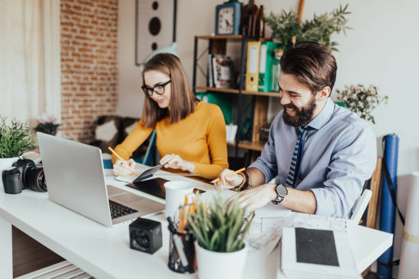 istock Two people working together in a home office 665924678