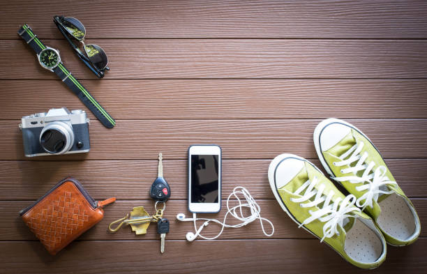 istock Travel objects on wooden background top view 665924908