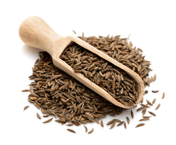 Cumin in a scoop for spices stock photo