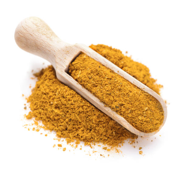 istock Curry spice in a scoop for spices 665931504