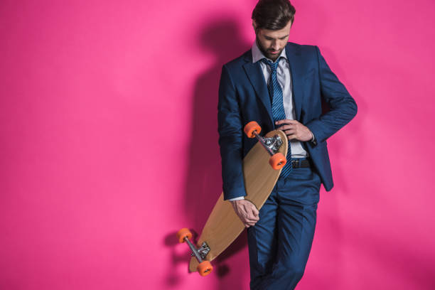 istock man in suit with skateboard 665931594