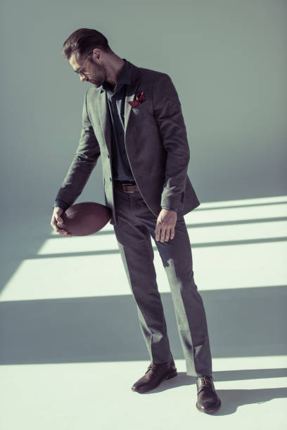 istock Stylish man with rugby ball 665932284