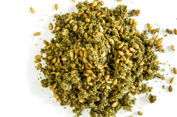 istock Dry hyssop leaves and seeds heap isolated on white 665946754