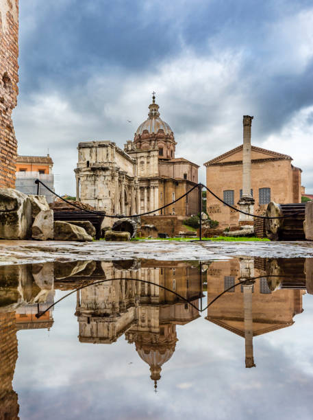 roman forum in rom - blue rain rome italy stock-fotos und bilder