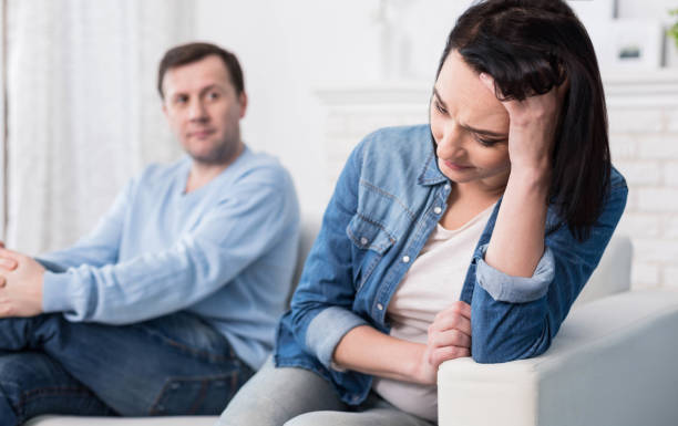 istock Sad depressed woman holding her forehead 665954106
