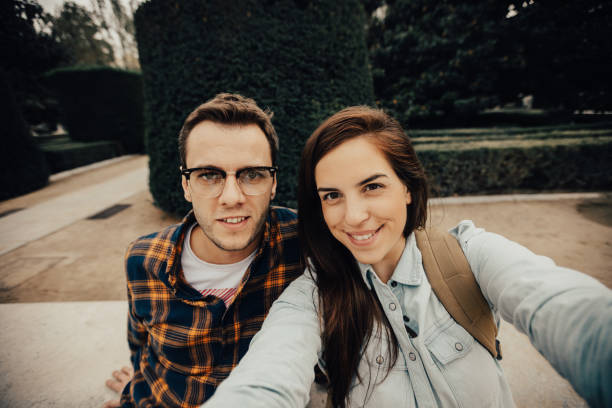 istock Charming young couple on a vacation in Spain taking selfie. 665979378