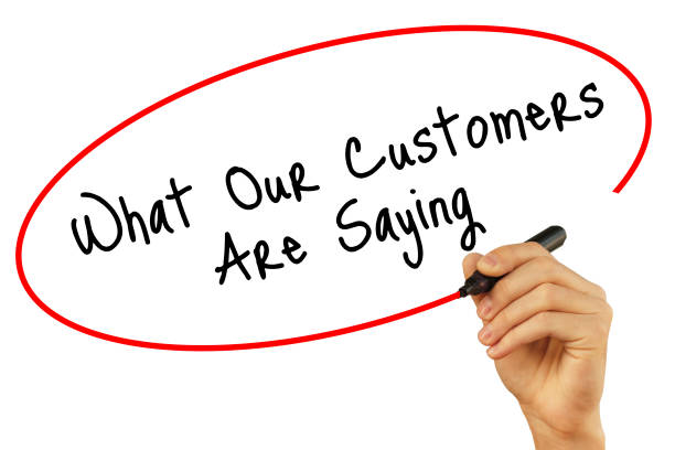 istock Man Hand writing What Our Customers Are Saying with black marker on visual screen. Isolated on white background. Business, technology, internet concept. Stock Photo 665985128