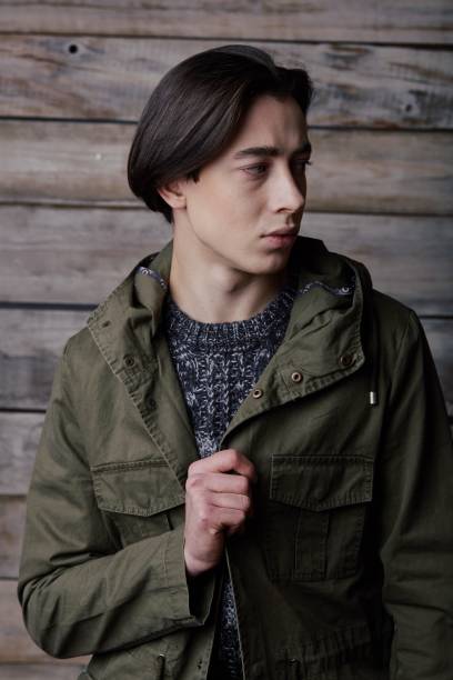 istock Handsome man in wooden rural house interior 665986210