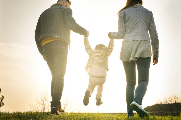 istock Happy family heaving fun in the park. 665991092