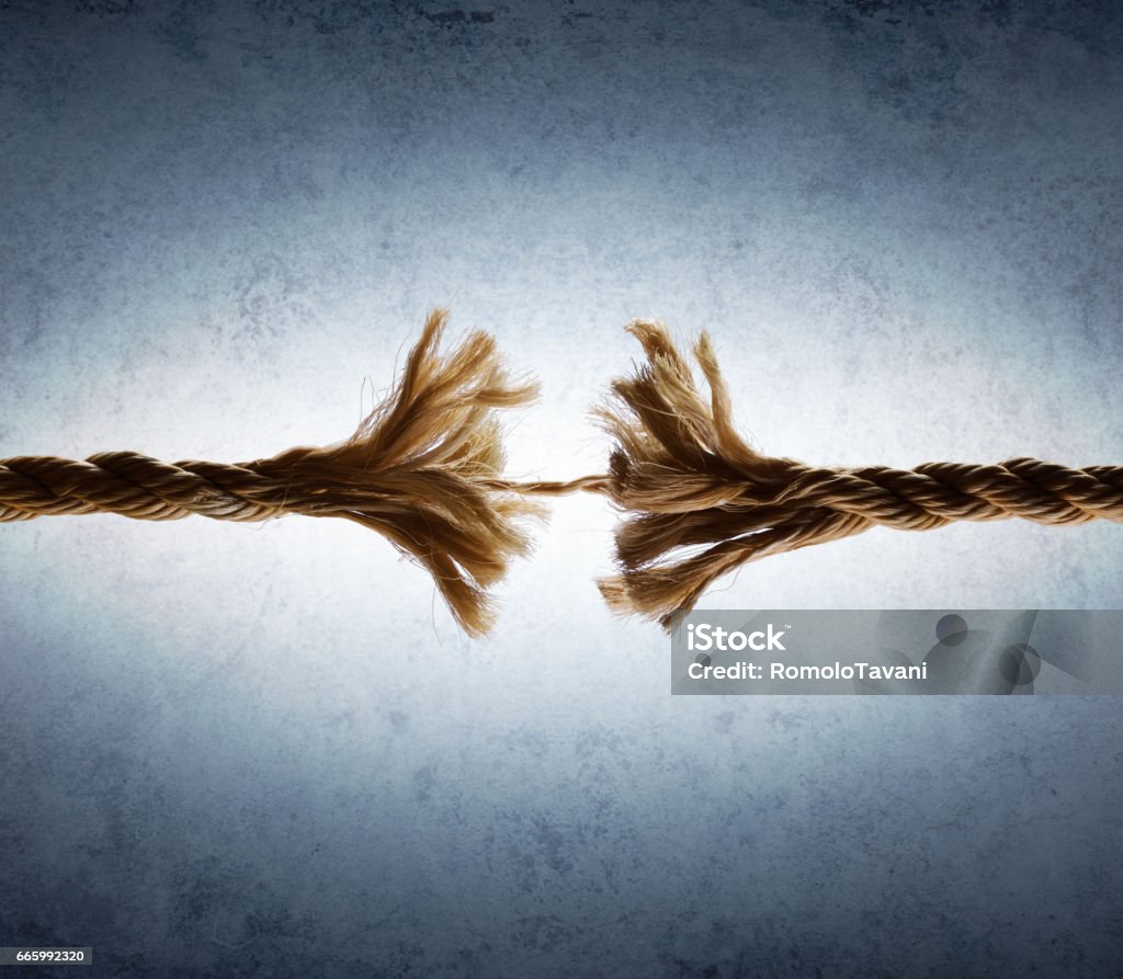 Rope Frayed In Tension - Risk Of Breaking broken string - tension concept Rope Stock Photo