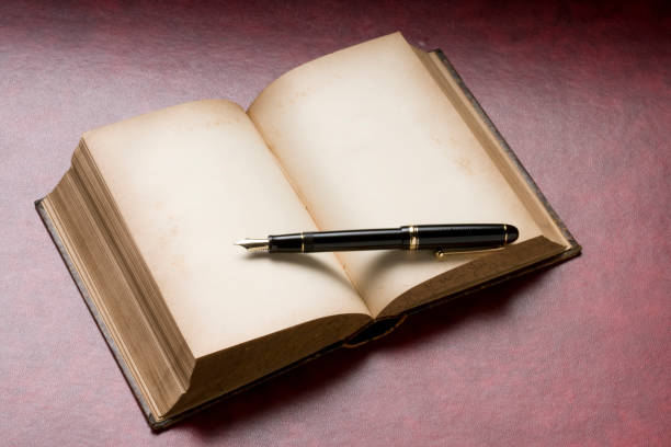 istock Antique book and pen 666002050