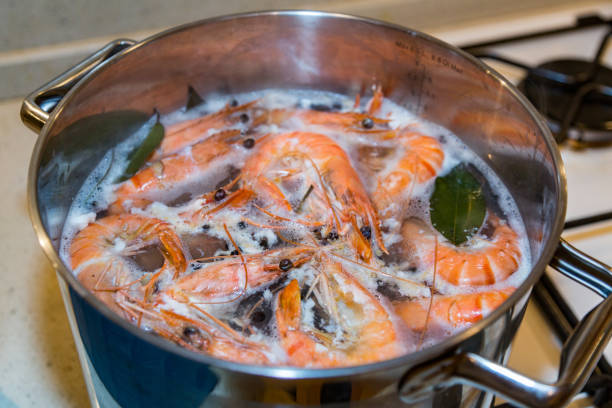 istock Large tiger shrimps are cooked in a saucepan 666002620