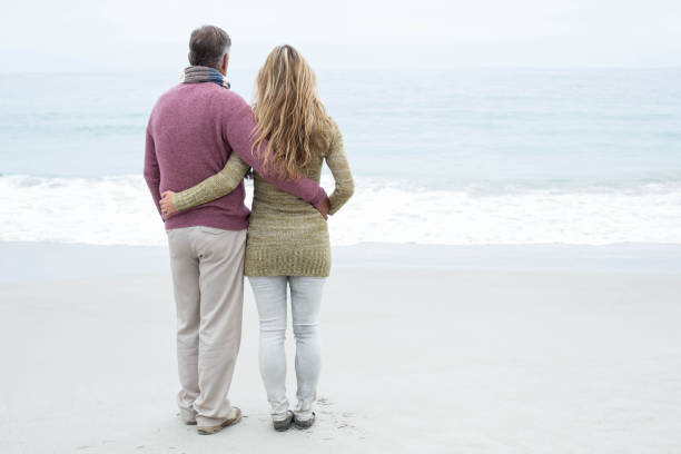 istock Happy couple standing holding each other 666011628