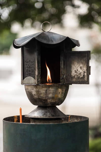 istock Traditional oil lamp lit at the buddhist temple. 666020142