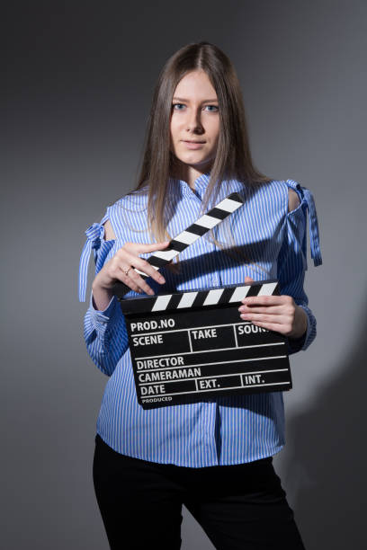 istock Young woman with a movie clapper 666021068