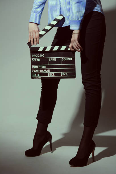 istock Woman with movie clapper 666021092