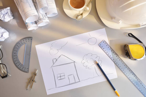 istock Working table of construction engineer with conceptual house drawing top 666024464