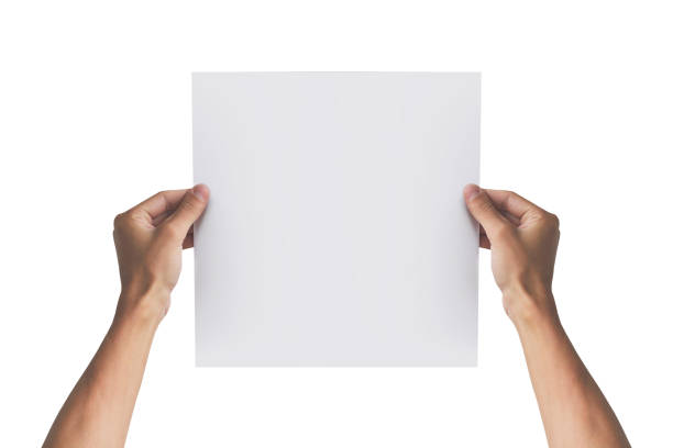 istock Two hands holding square paper in the right hand. Leaflet presentation. Pamphlet hand man. Man show offset paper. Sheet template. Book in hands. Booklet folding design. Fold paper sheet display read. 666025406