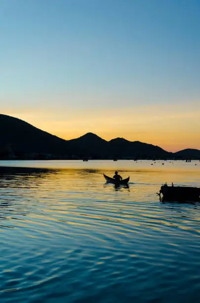 the silhouettes of lonely fishman at Nai lagoon, Ninh Thuan