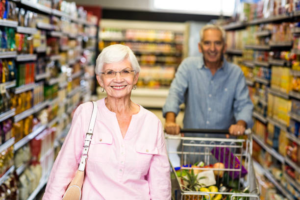 istock Happy senior woman smiling at camera 666040328