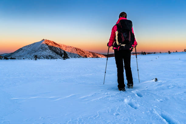 istock Young female trekker watching sunset in the mountains 666048230