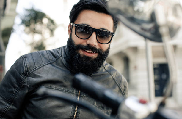istock Portrait of happy young man with long beard 666048316