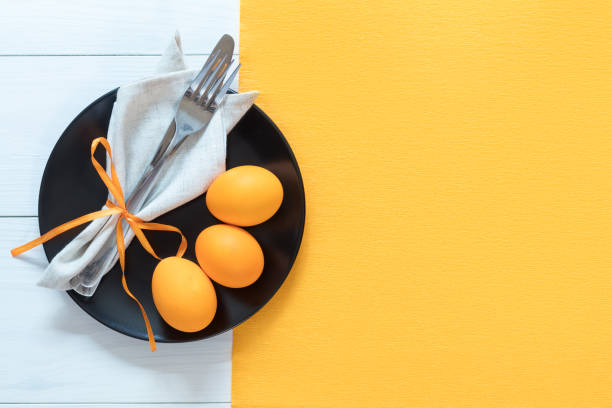 Easter table setting with eggs and cutlery stock photo